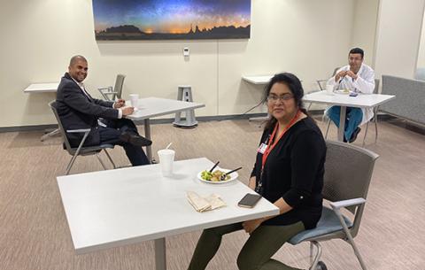 Drs. Preethi William, Tushar Acharya and Deepak Acharya practice physical distancing while taking a lunch break from their clinical work.