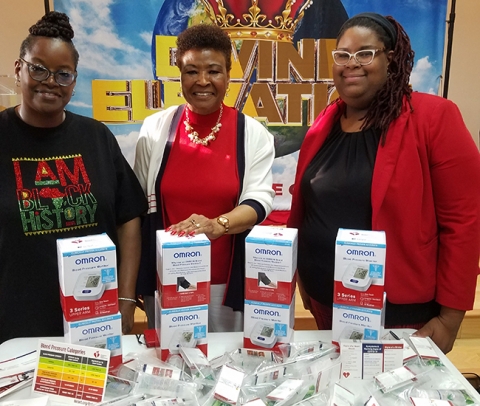 Lisa Harmon, trainer for the self-monitoring blood pressure program, Wanda F Moore, and the Reverend Je're Harmon, assistant pastor of New Trinity Temple CME Church (and Ms. Harmon’s daughter).